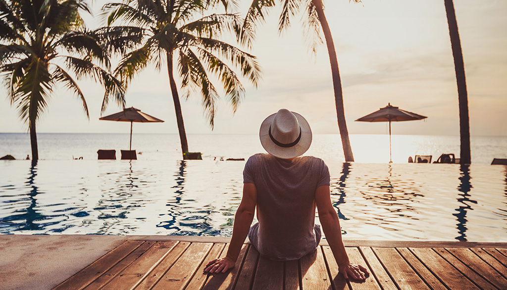 Tourist relaxing in luxury beach hotel